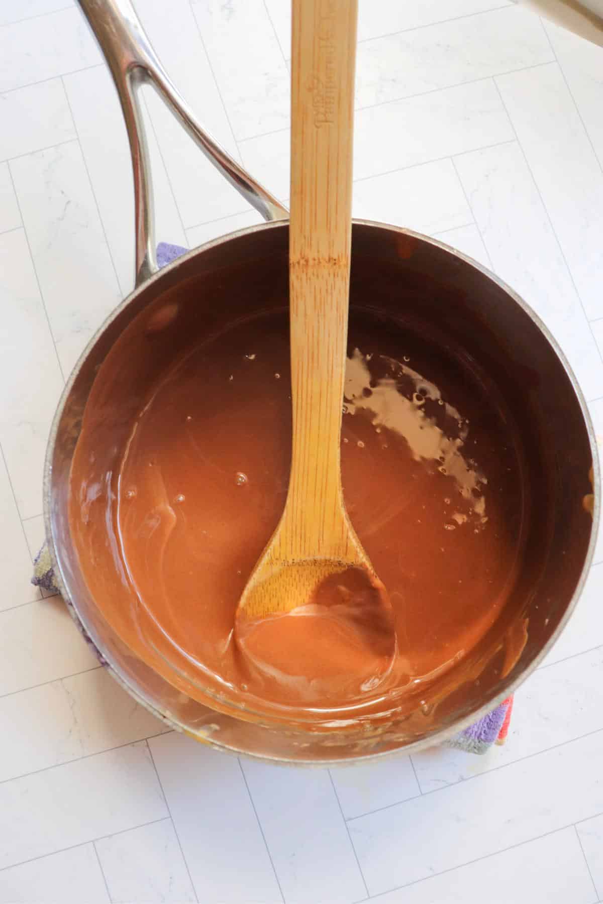 Melted peanut butter and chocolate in a sauce pan.