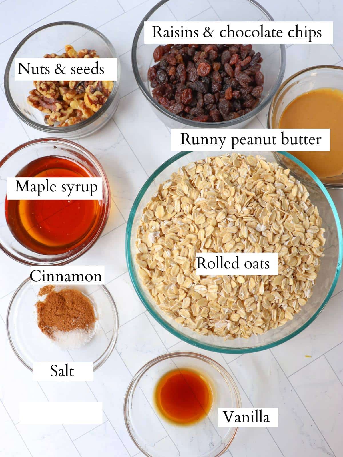 Ingredients for homemade vegan granola laid out on a counter.