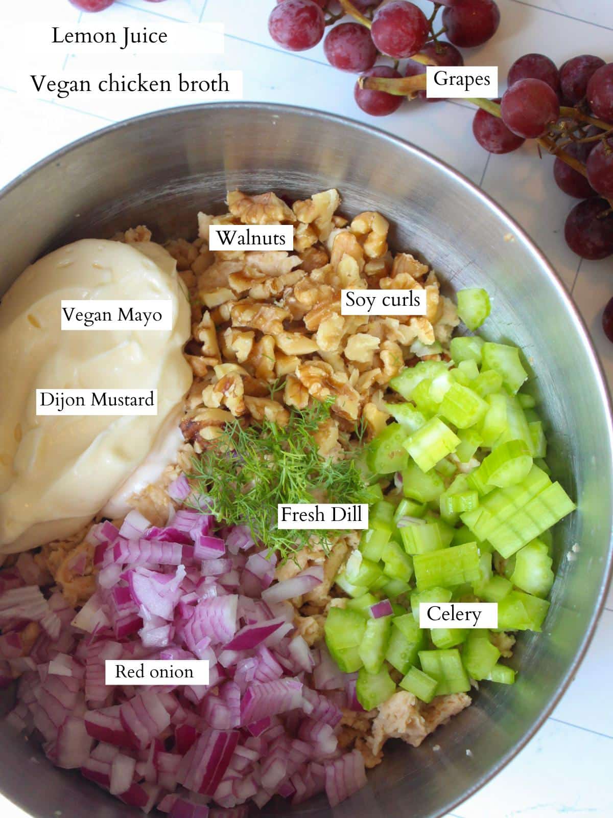 Ingredients for vegetarian chicken salad sandwich in a mixing bowl, before getting mixed together.