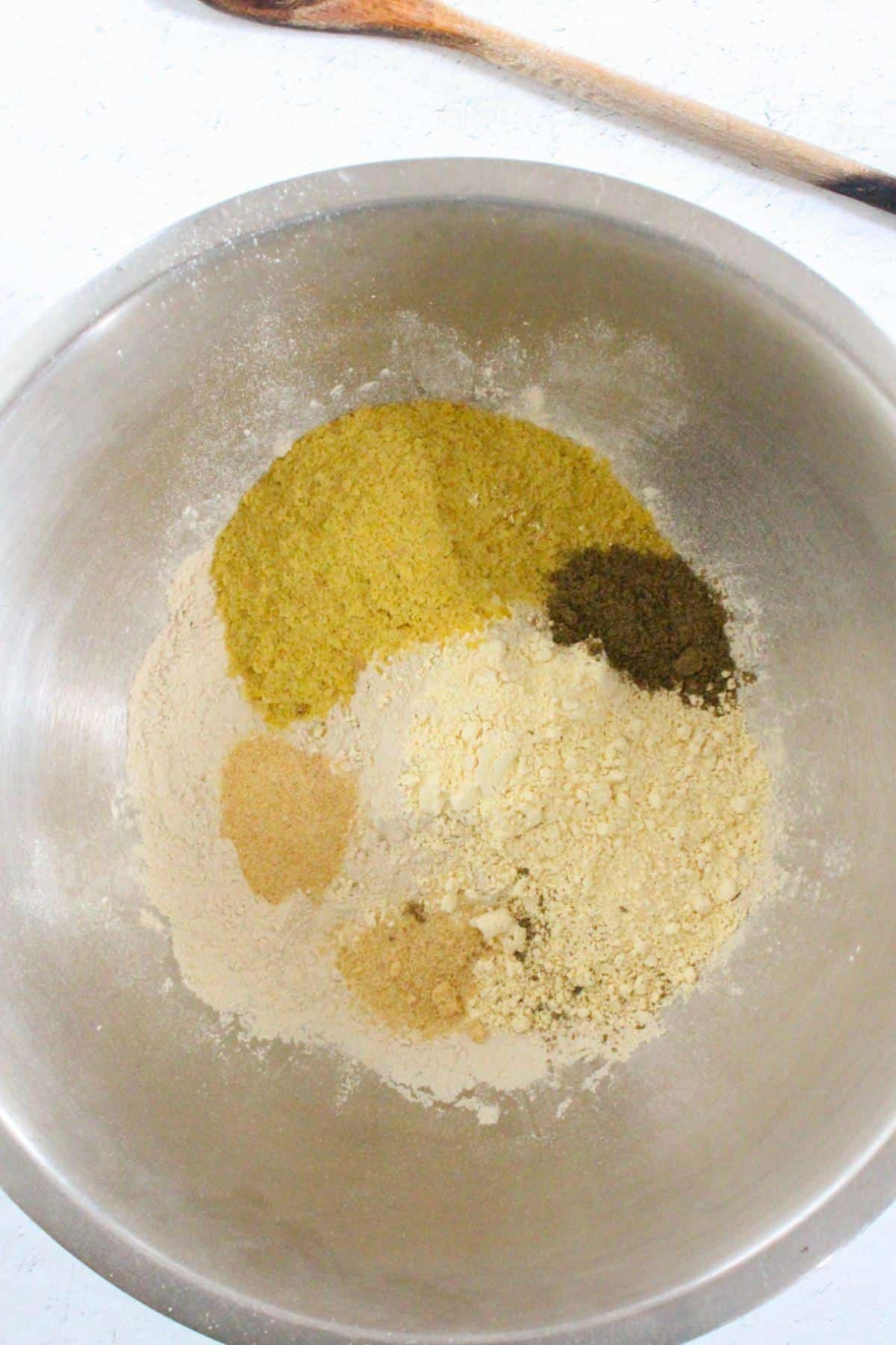 Dry ingredients for vegan seitan chicken in a mixing bowl.